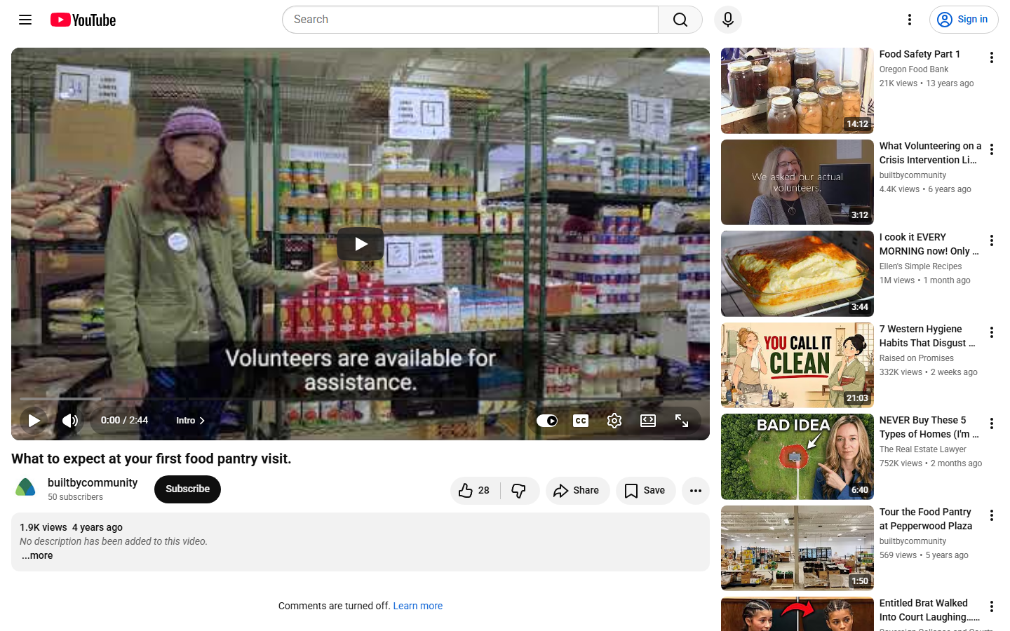 Screenshot of the YouTube watch page for CommUnity Crisis Services' video, with captions visible over food pantry shelves